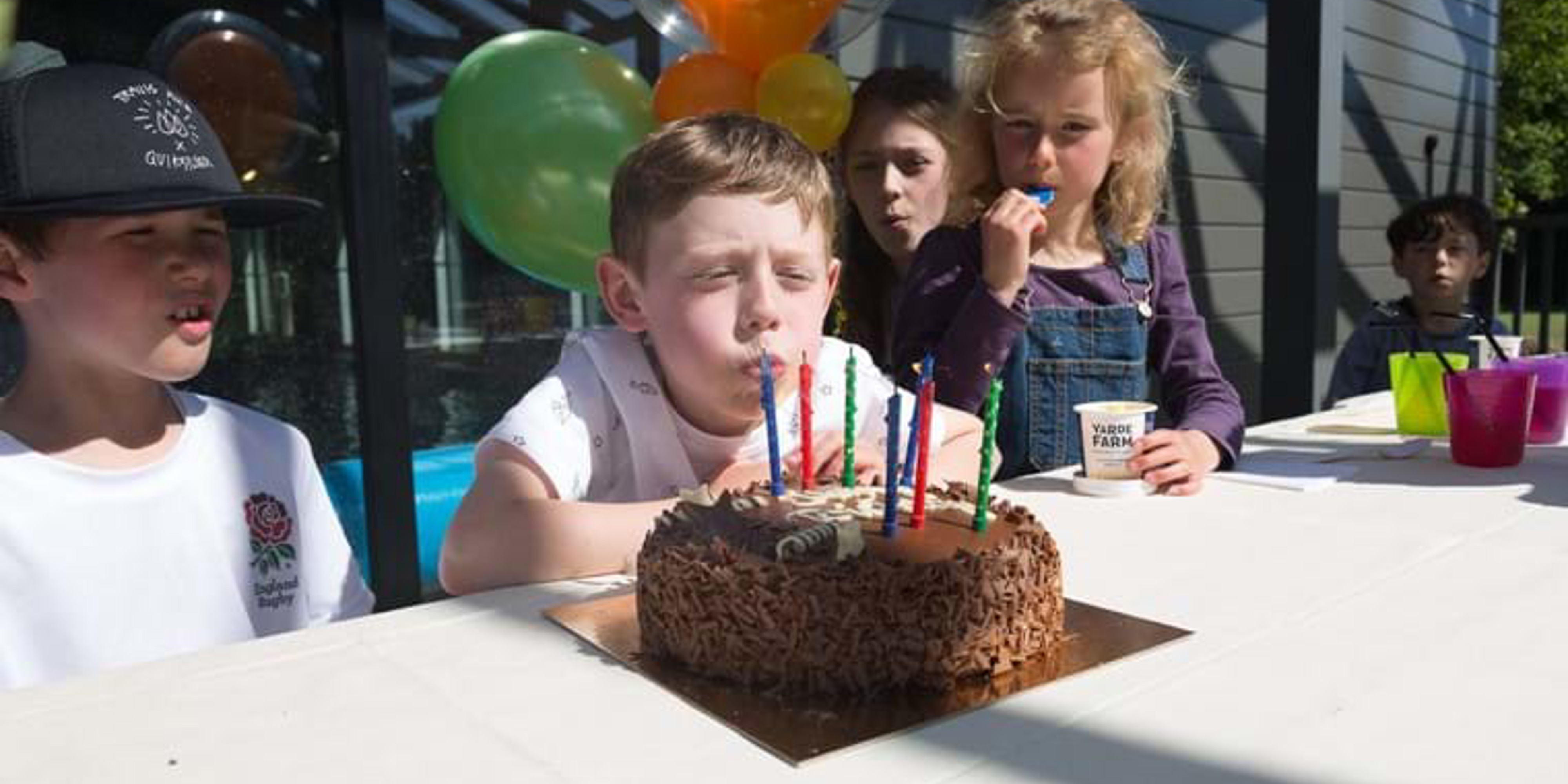 Boy blowing out his candles