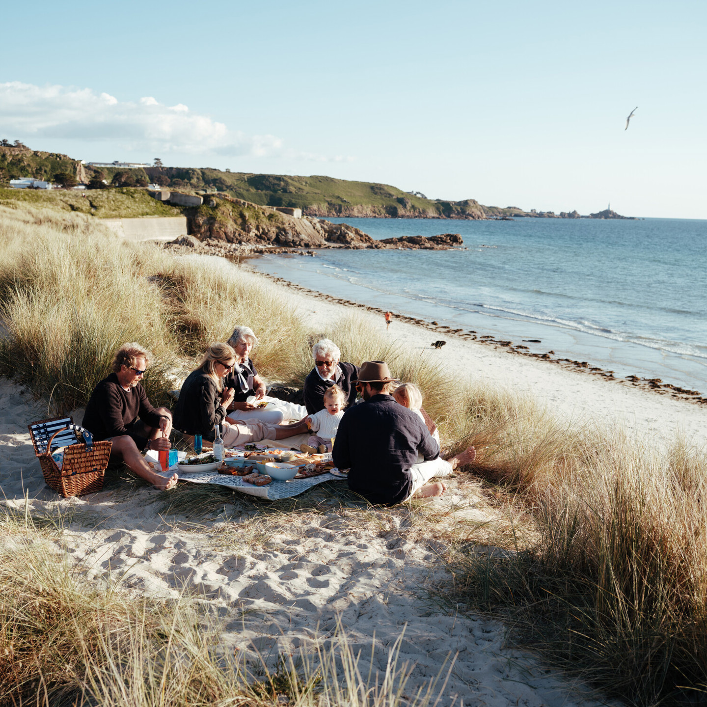 Family picnic alongside the bay