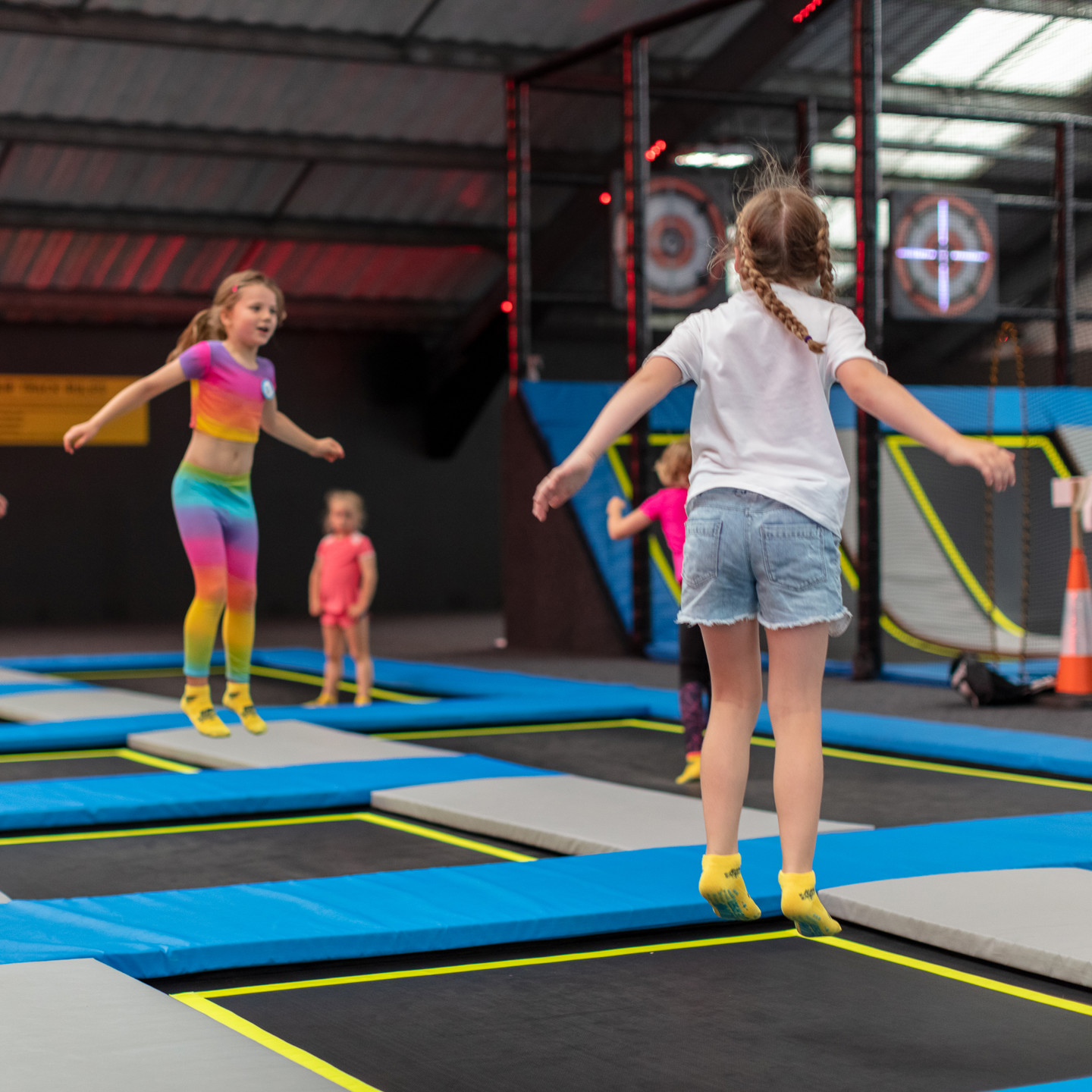 Girls bouncing on the trampolines