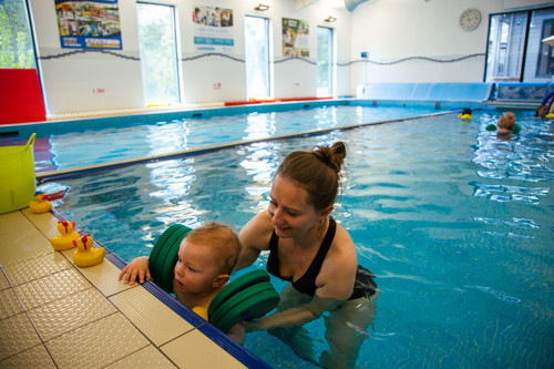 Mum and son during swimming lessons