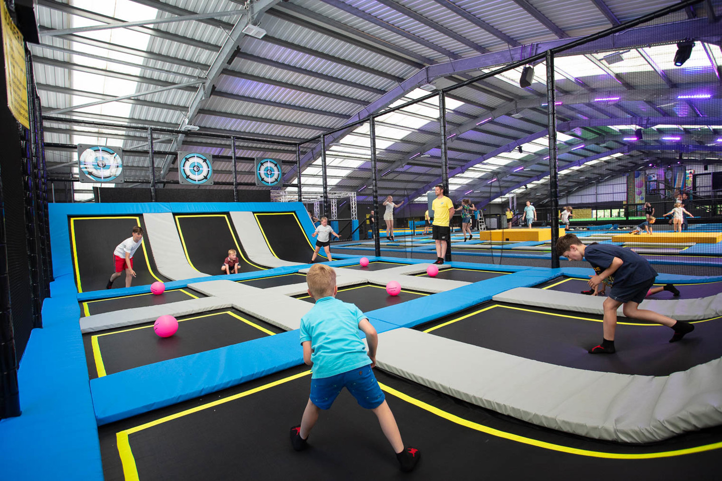 Kids playing on the trampoline dodgeball courts at Jump Jersey