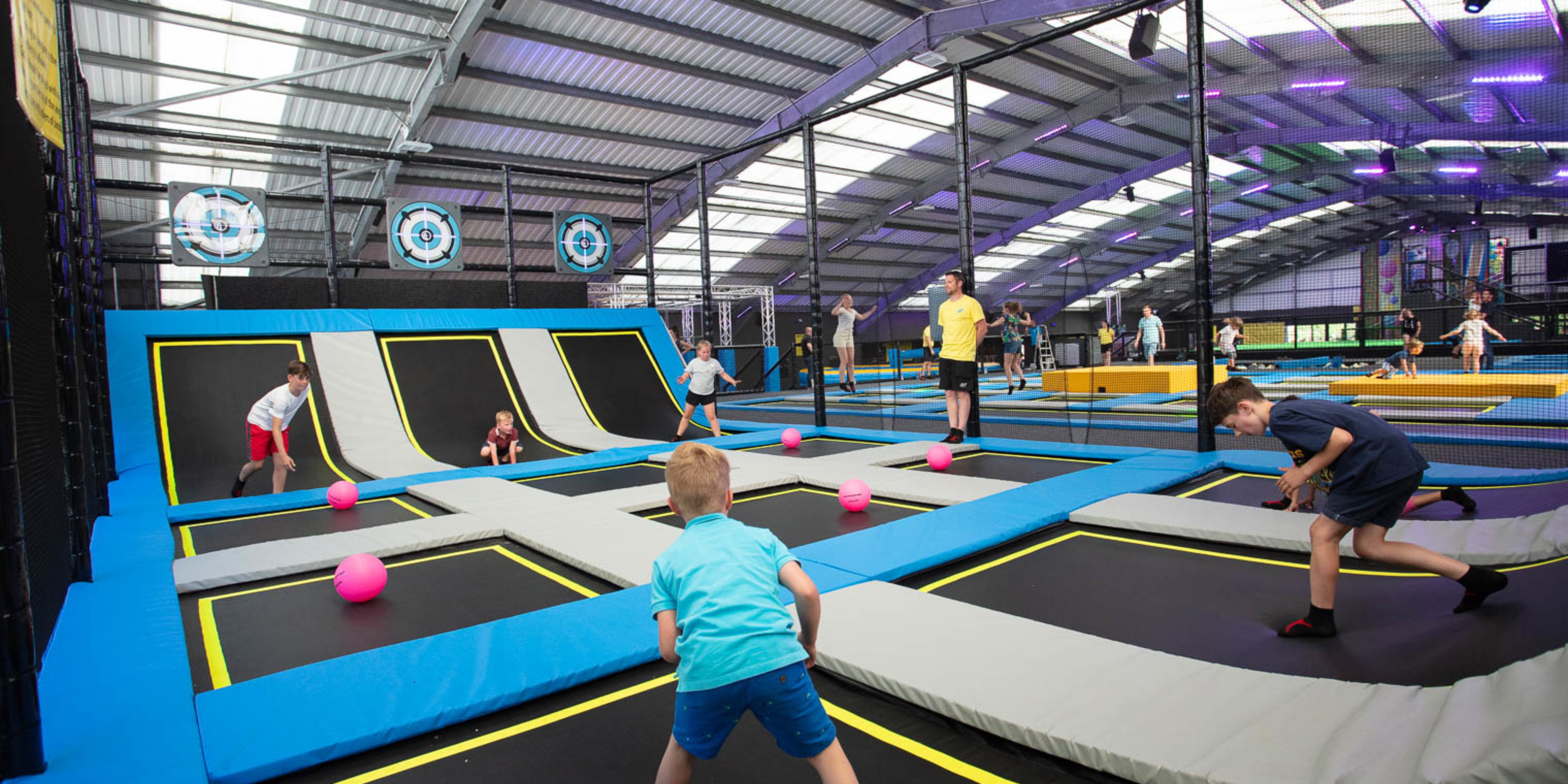 Kids playing on the trampoline dodgeball courts at Jump Jersey