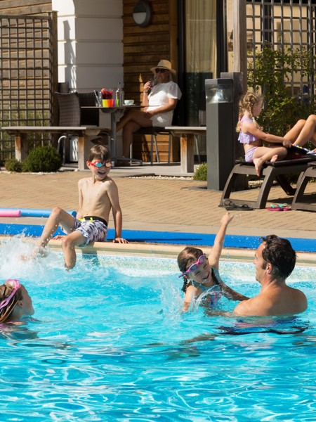 Family enjoying the outdoor pool