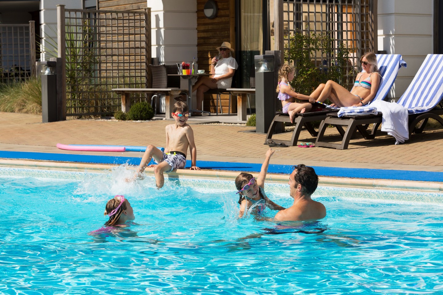 Family enjoying the outdoor pool
