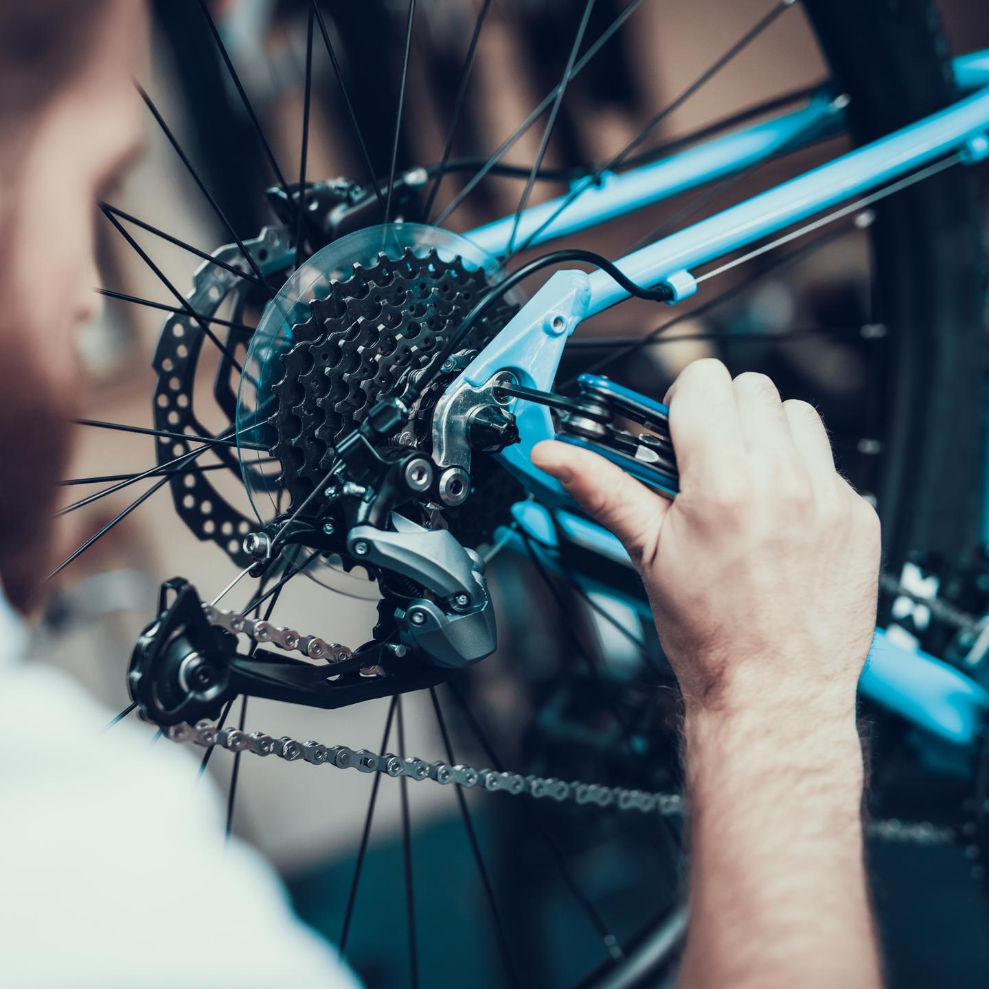 Mechanic servicing bike