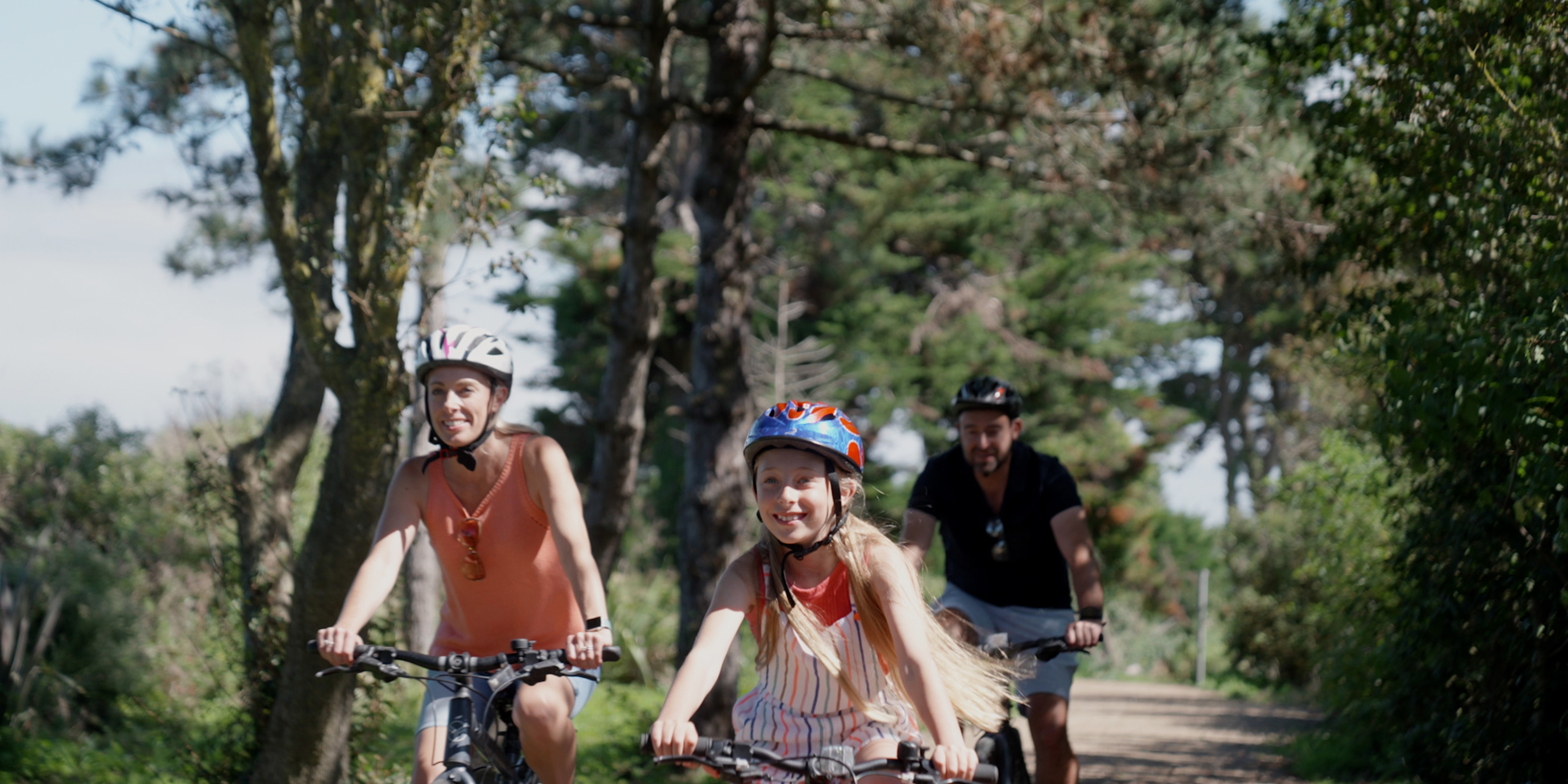 Family cycling along the cycle path