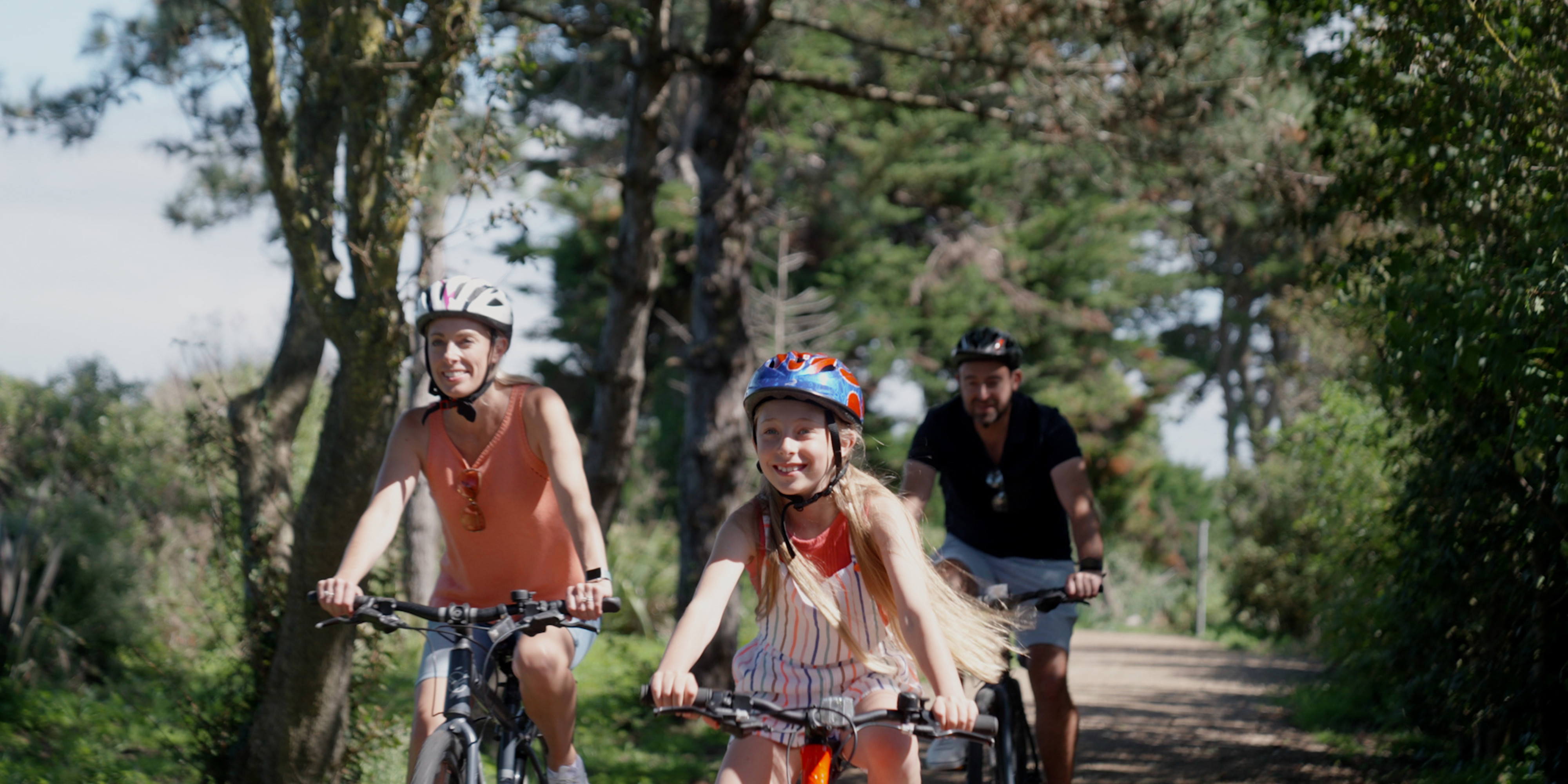 Family cycling along the cycle path