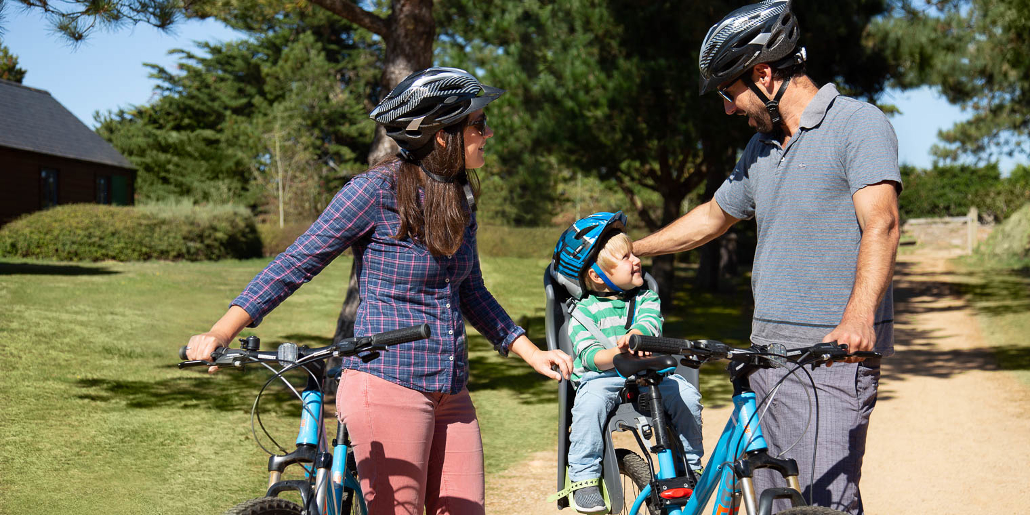 Young family on bikes with toddler