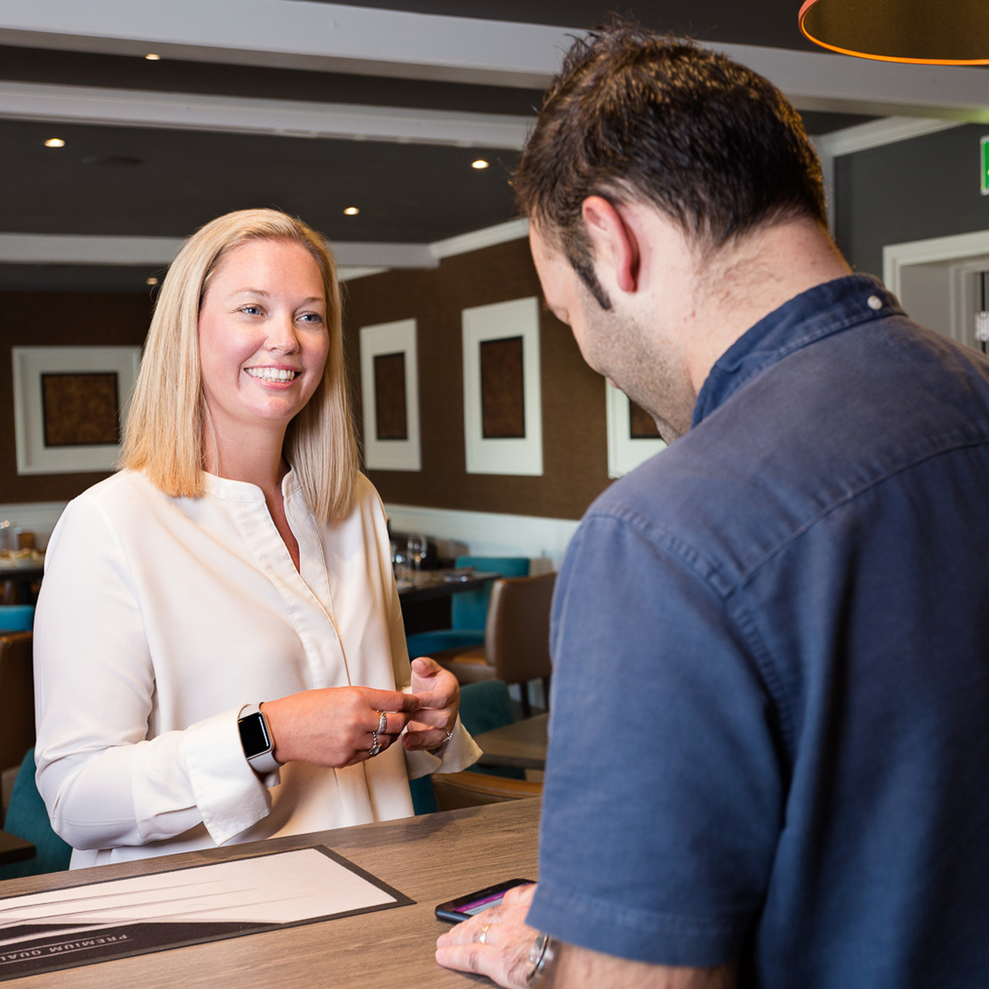 Staff greeting customer