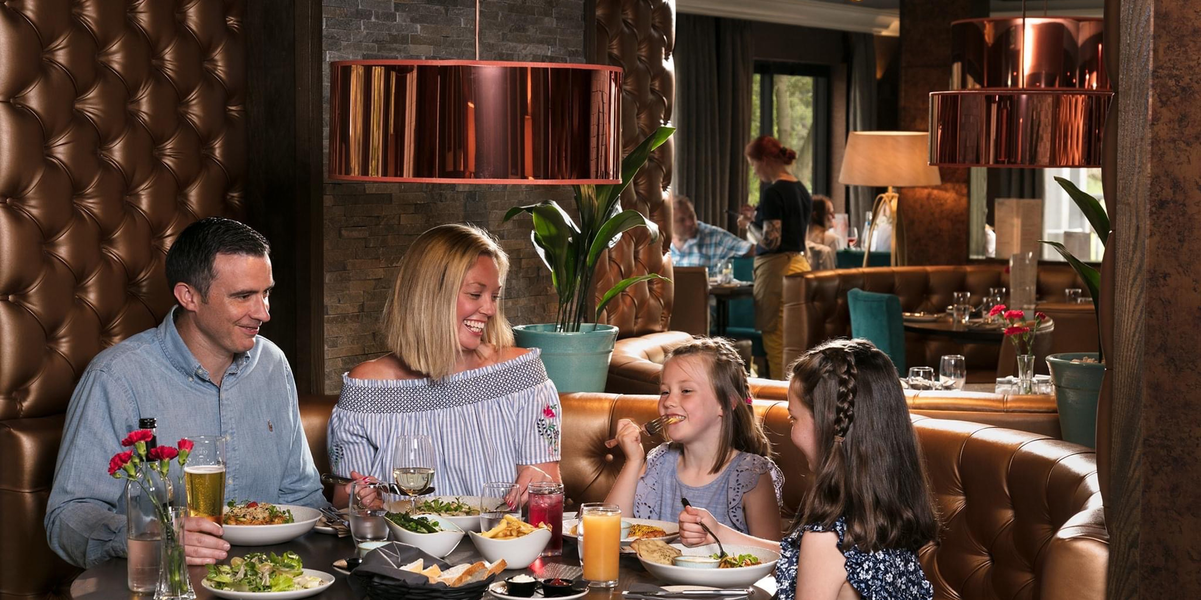 Family eating food in restaurant