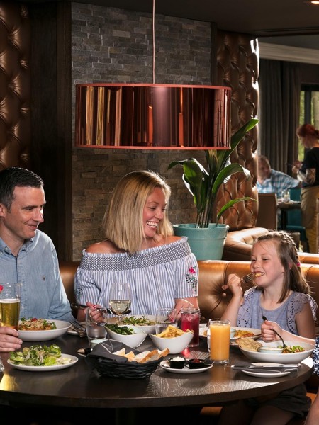 Family eating food in restaurant