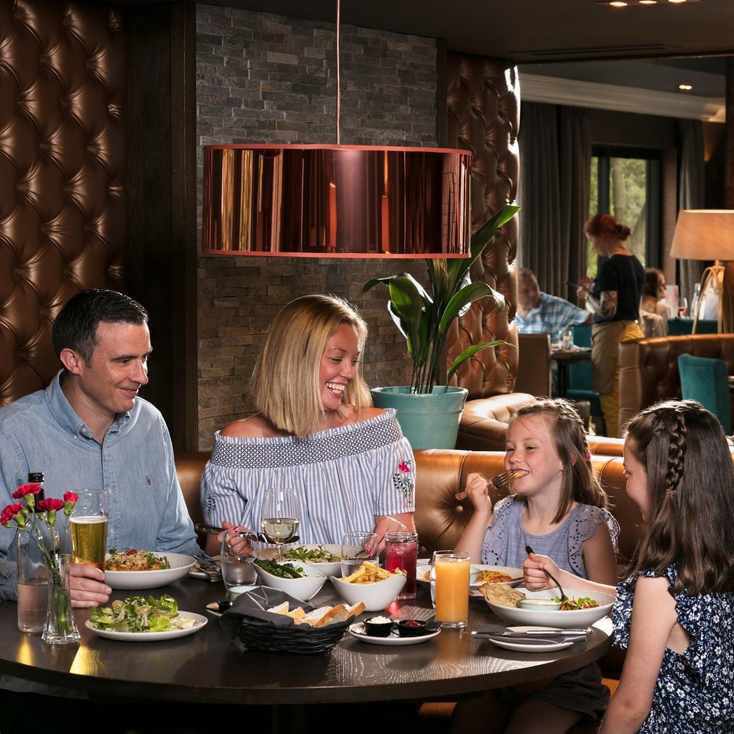 Family eating food in restaurant