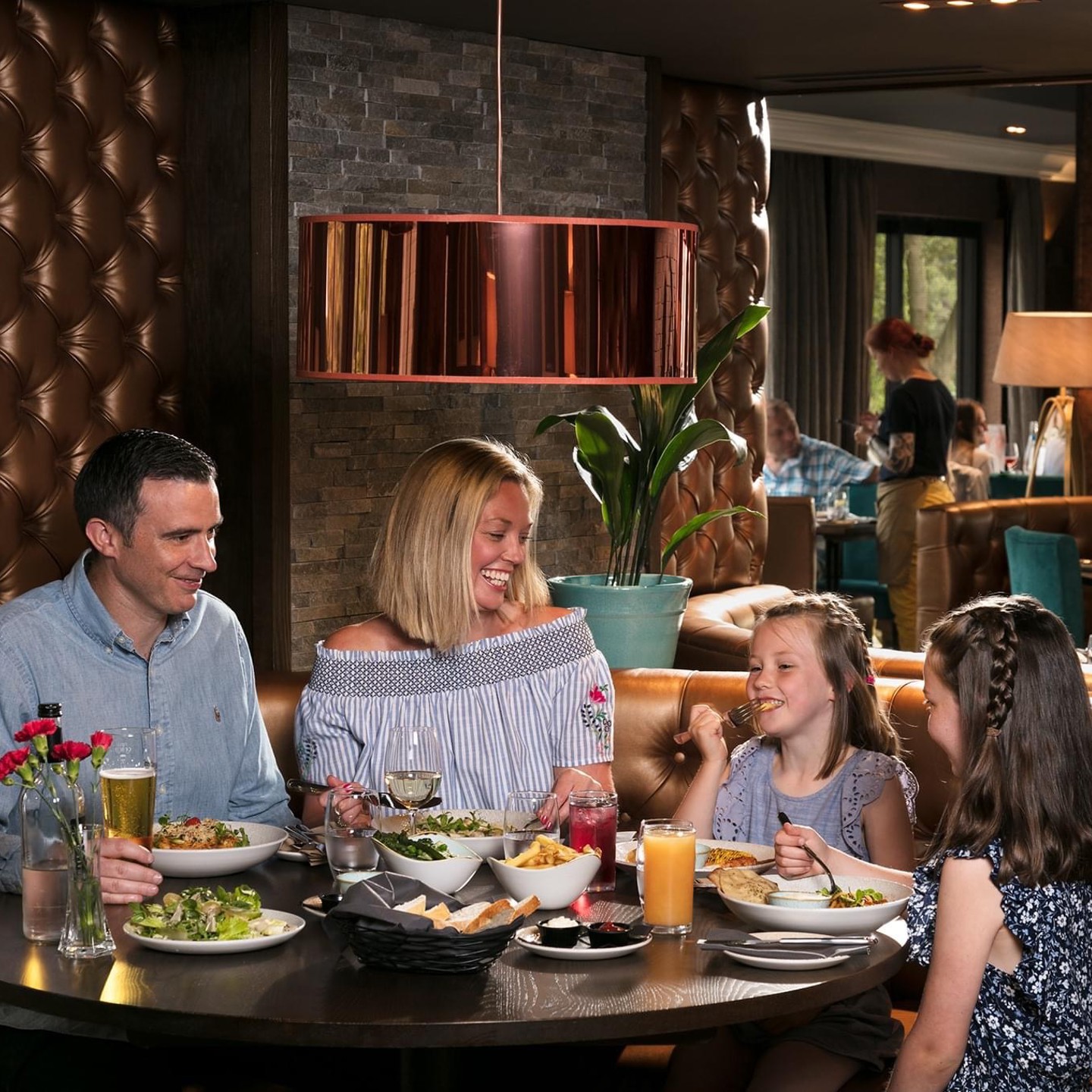 Family eating food in restaurant